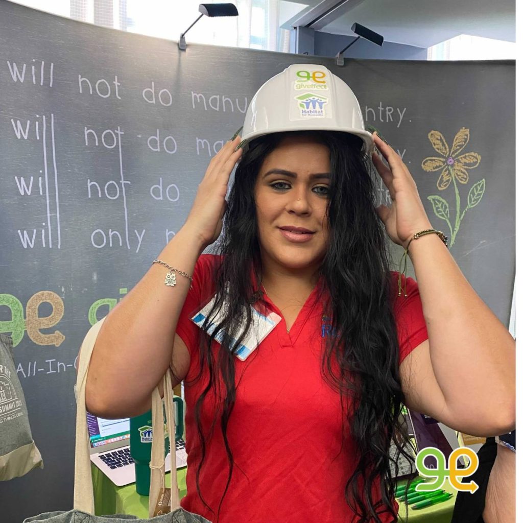 Woman participating in the Habitat for Humanity and Giveffect construction hat selfie contest