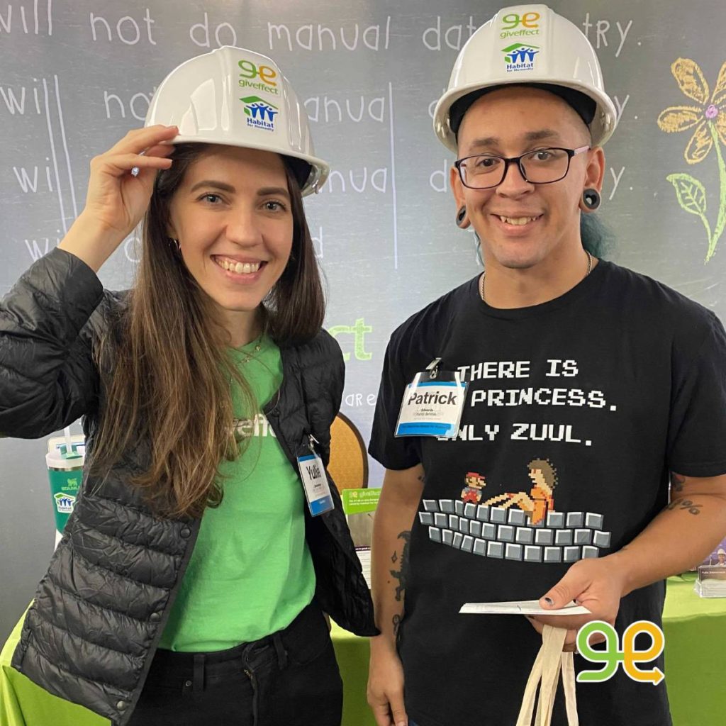 Yulia and Patrick posing with their Habitat for Humanity and Giveffect construction hat for their selfie as part of the giveaway.