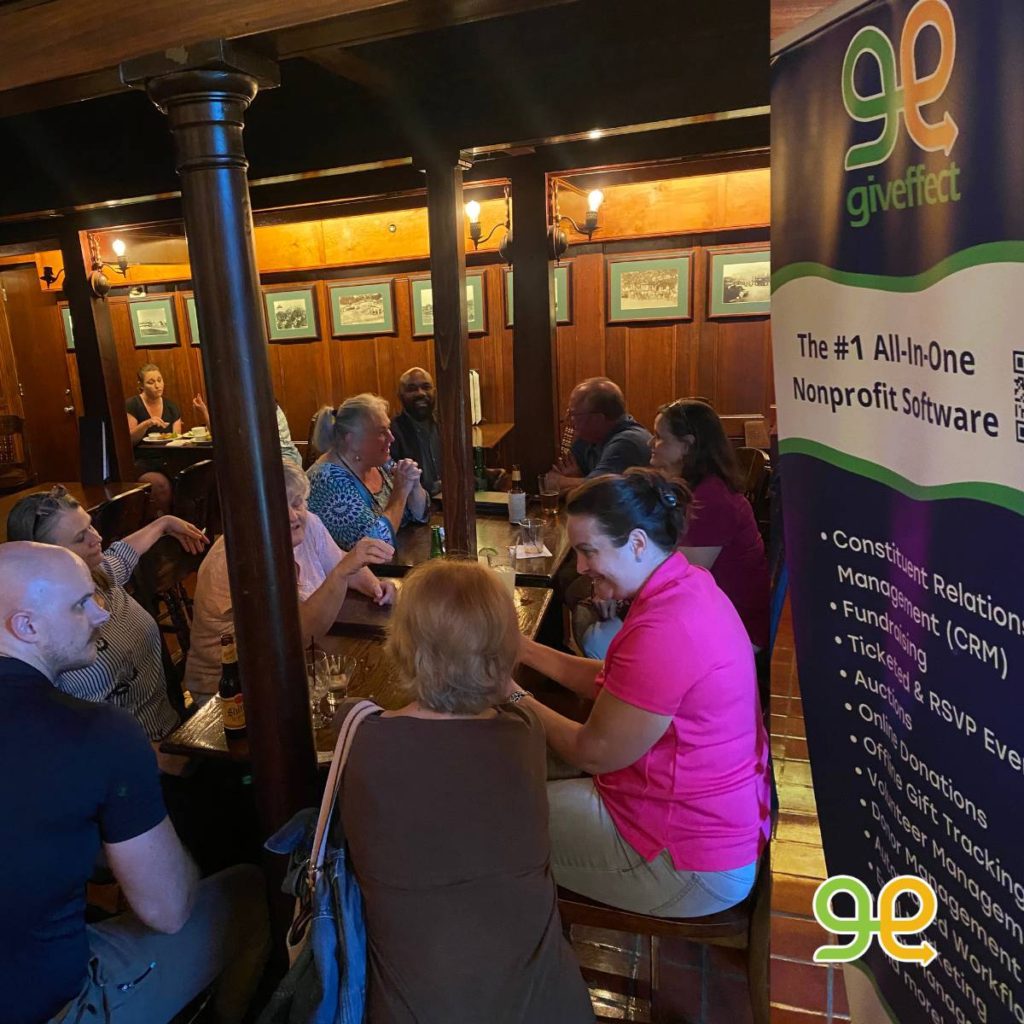 A group of people enjoying the Giveffect sponsored happy hour at the Habitat for Humanity Texas Lone Star Summit